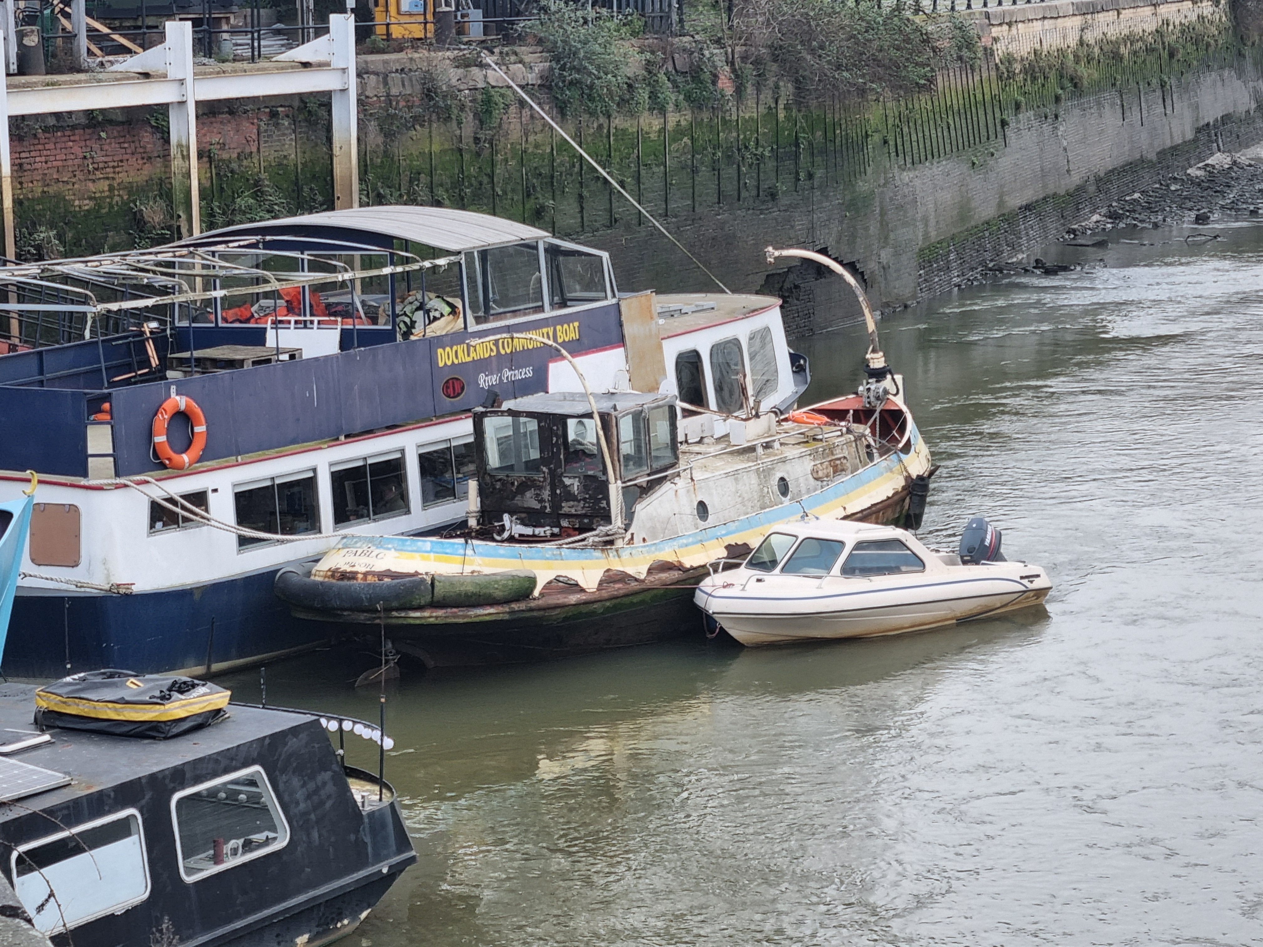Showery moored alongside a vessel at Cody Dock