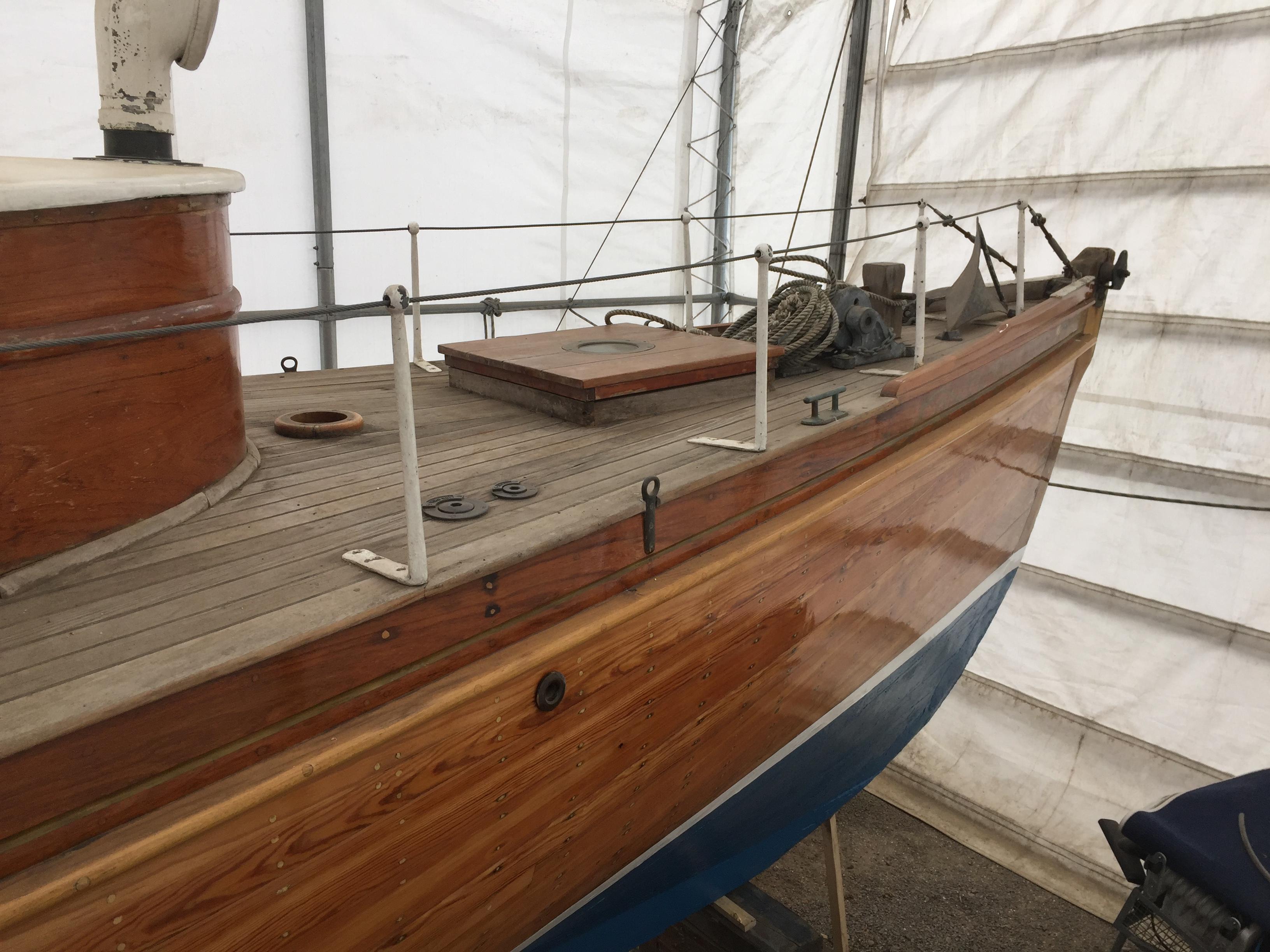 Sgur Urain hauled out at Bray Marina in 2026, showing her structurally exposed carvel hull and open framing prior to transit. 