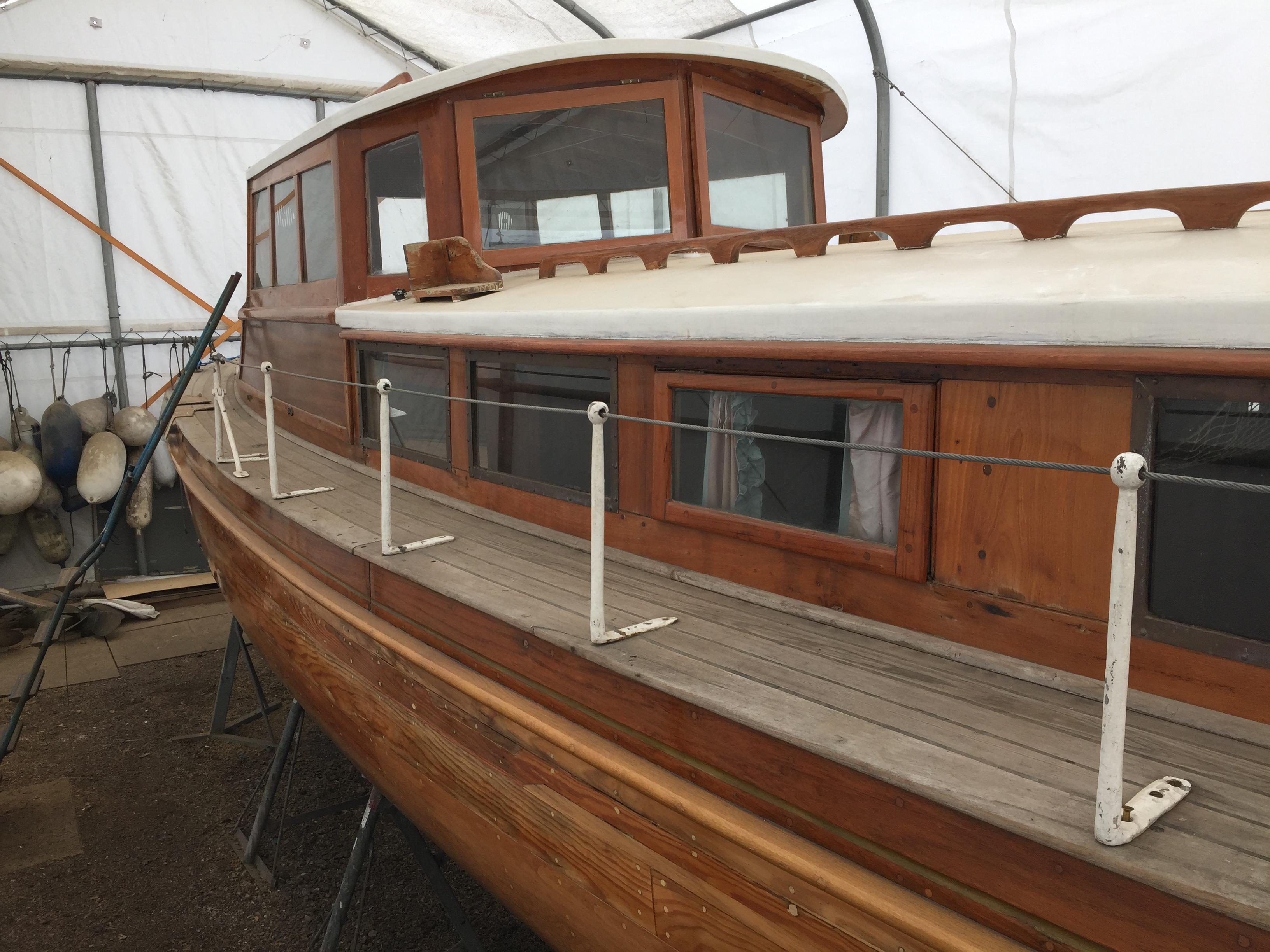 Sgur Urain hauled out at Bray Marina in 2026, showing her structurally exposed carvel hull and open framing prior to transit. 