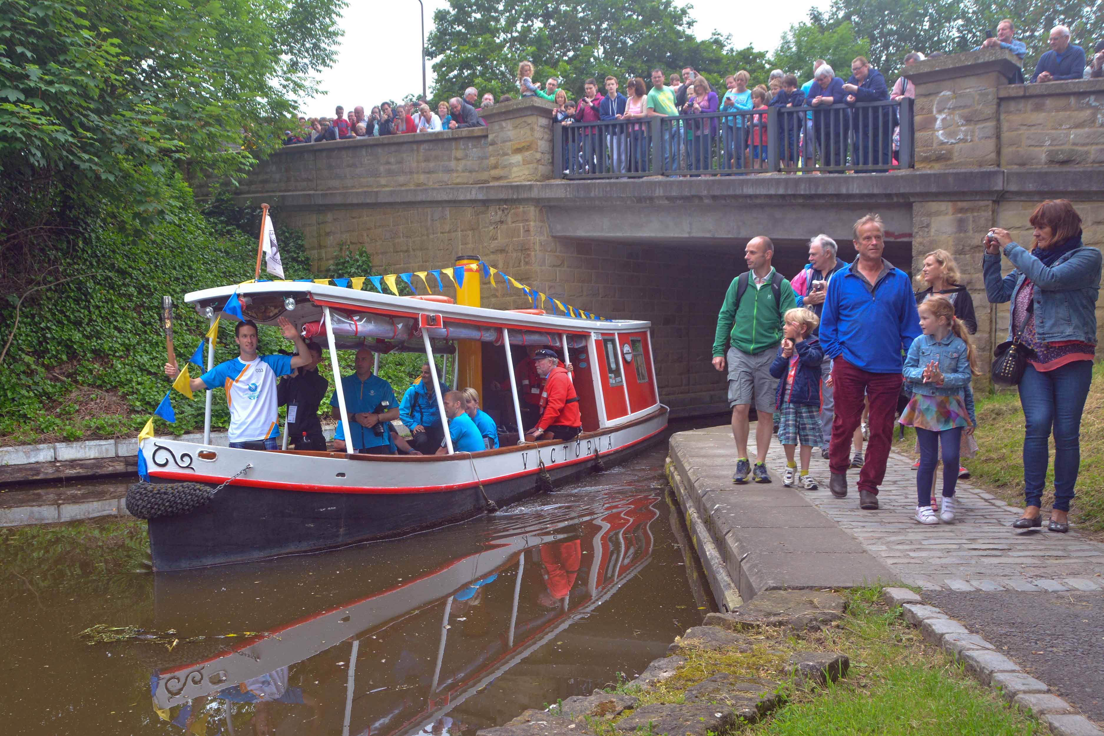 Victoria carrying the Olympic torch, July 2012