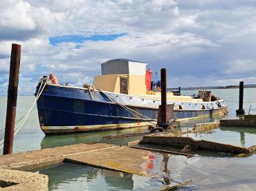 Riverman moored