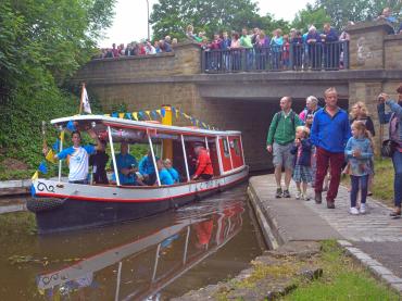 Victoria carrying the Olympic torch, July 2012
