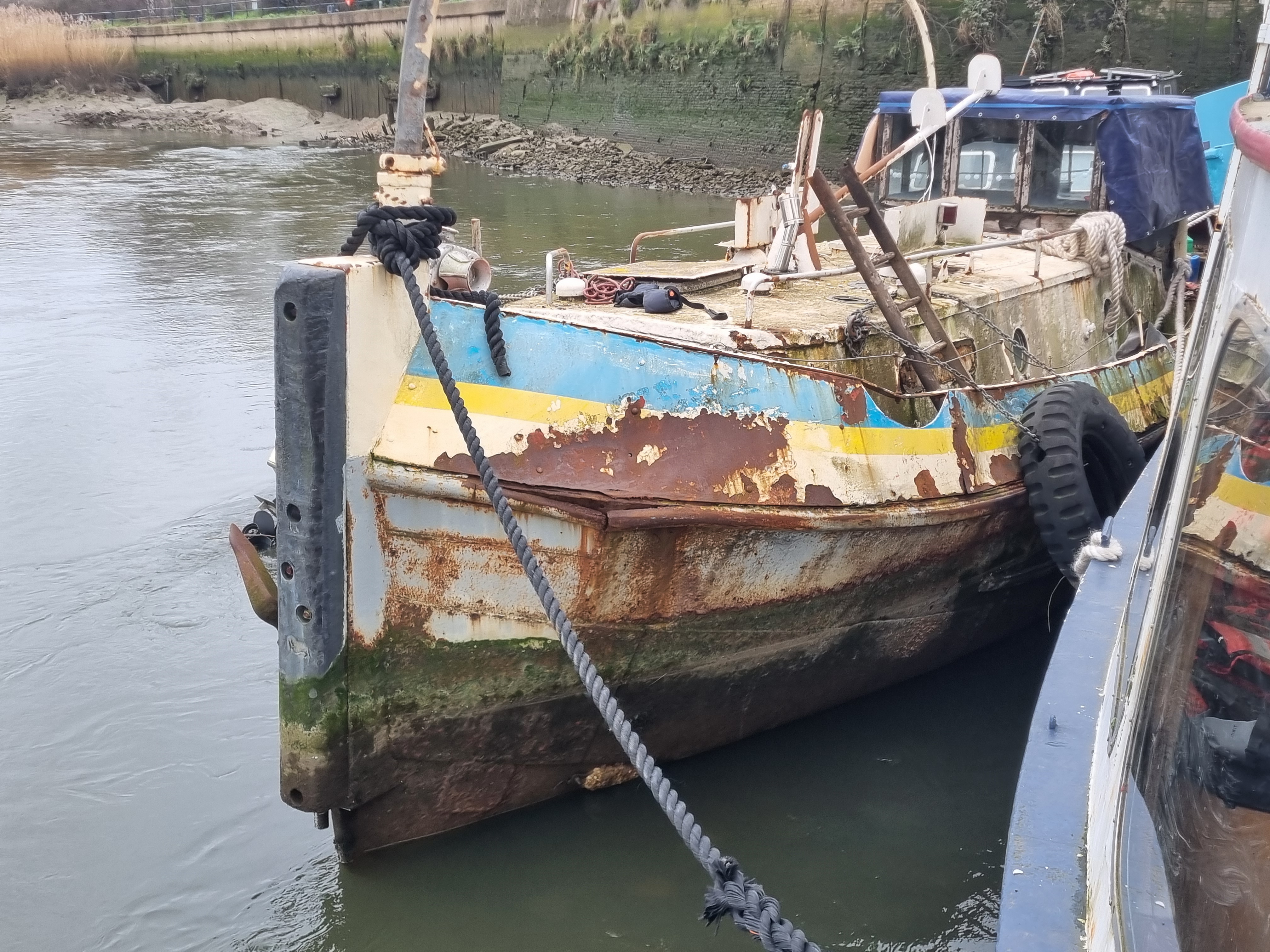 Showery moored alongside a vessel at Cody Dock